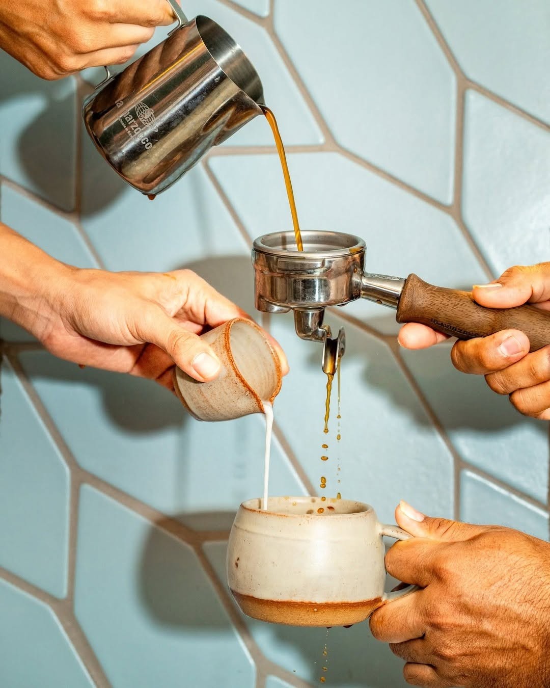 Baristas working together to prepare espresso