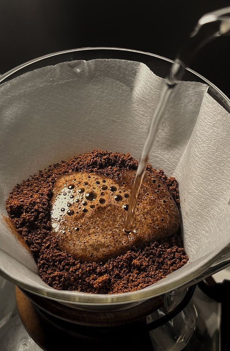 Fresh filter coffee brewing through a paper filter